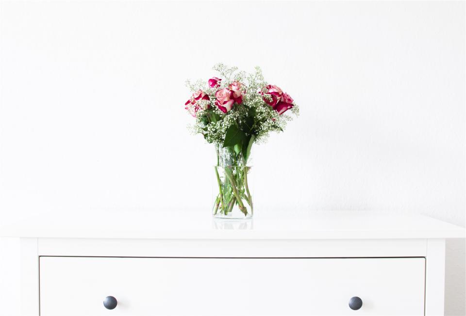 White dresser with flowers